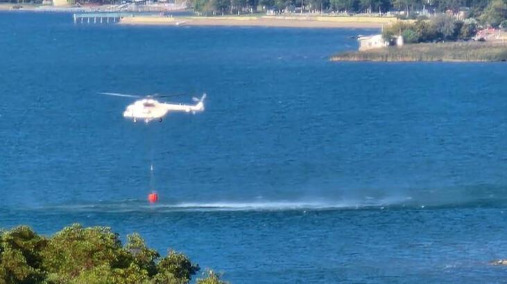 İznik’te orman yangını! Helikopter defalarca gölden su aldı